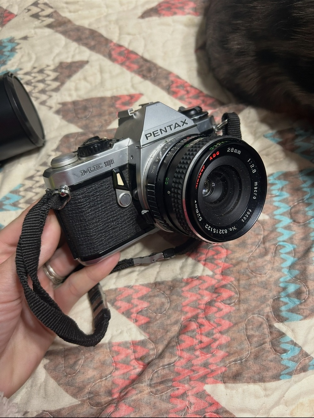 Pentax silver and black SLR with 28mm f/2.8 lens